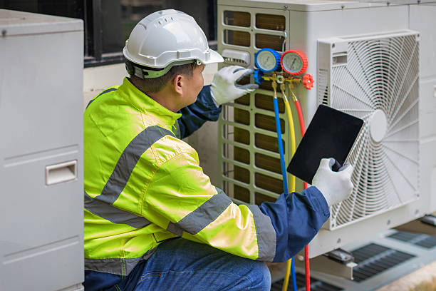 Professional Air Conditioning Repair technician working in Manson, WA